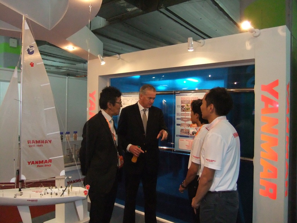 Peter having a chat with company staff about their activity © YANMAR Racing . http://www.yanmar.co.jp/en/racing/